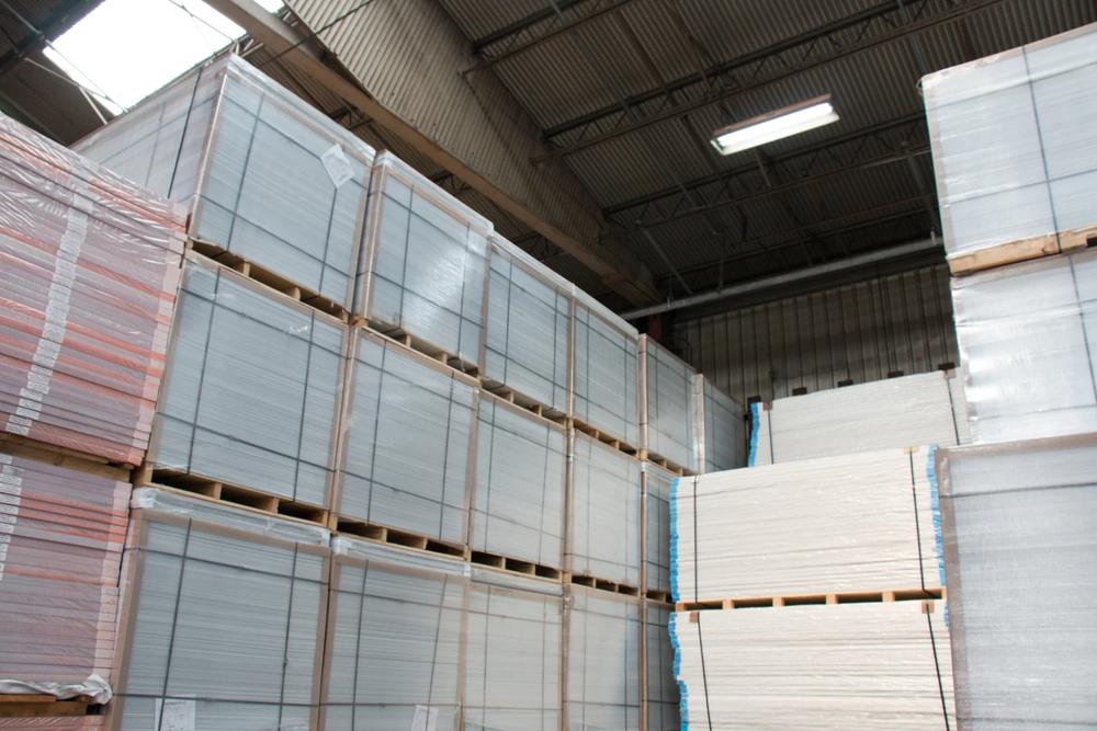 Pallets of corrugated plastic sheets in the warehouse